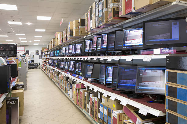 Monitors displayed in shelves at an electronic store